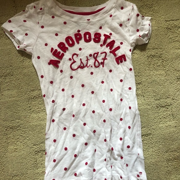 white shirt with red writing